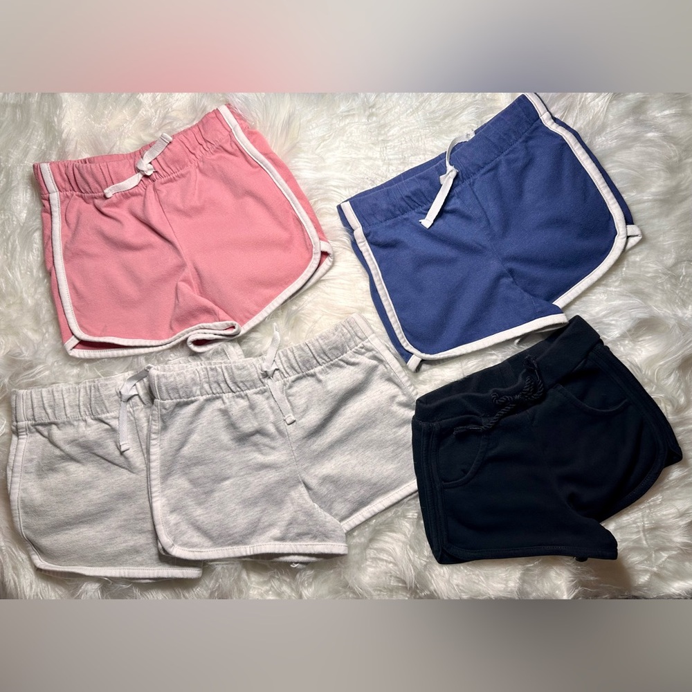 Osh Kosh girl shorts Set of 5 
Sizes: 
Pink, Blue & Gray 5T 
Grey 6X
Black 4T